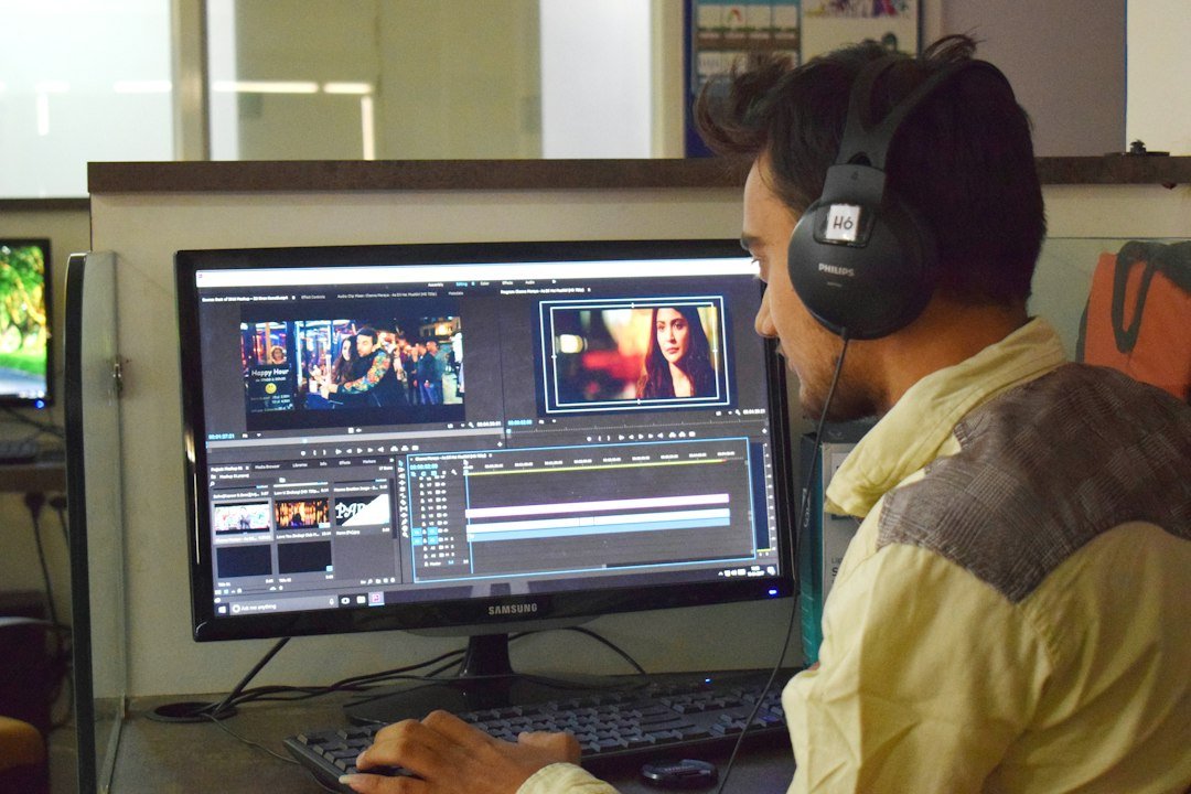 A video editor working at a studio computer